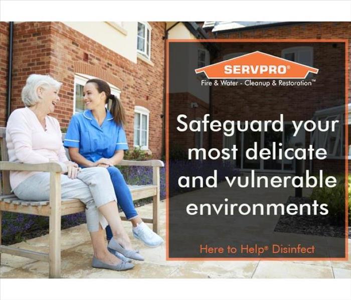 Nurse and senior citizen sitting on a bench outside assisted living facility 